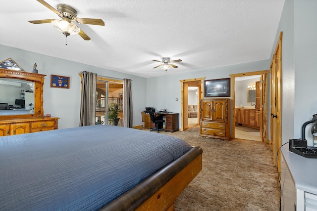 12990 Old Hill City Rd, Keystone, SD 57751 - bedroom featuring carpet, connected bathroom, a ceiling fan, a textured ceiling, and access to outside