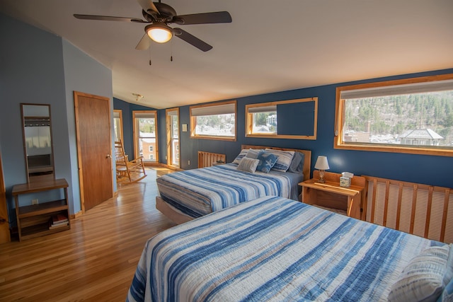 10 Centennial Ave, Deadwood, SD 57732 - bedroom with light wood-style floors, vaulted ceiling, and a ceiling fan