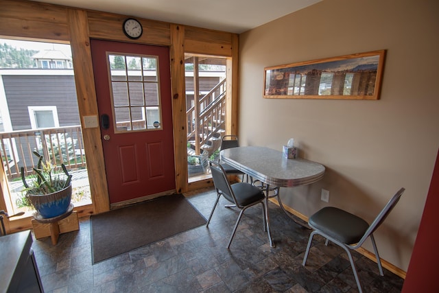 10 Centennial Ave, Deadwood, SD 57732 - dining space featuring stone tile floors, baseboards, and stairway