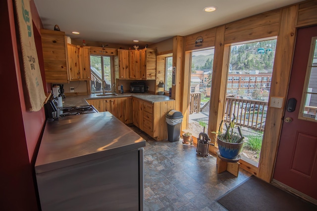 10 Centennial Ave, Deadwood, SD 57732 - kitchen with stone finish flooring, a sink, recessed lighting, range with electric stovetop, and brown cabinetry