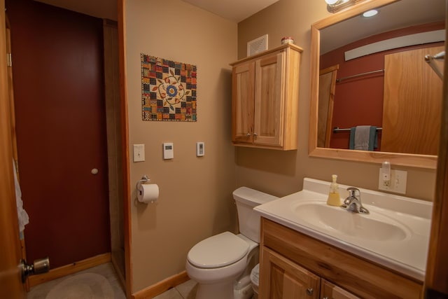 10 Centennial Ave, Deadwood, SD 57732 - bathroom with toilet, vanity, tile patterned flooring, and baseboards
