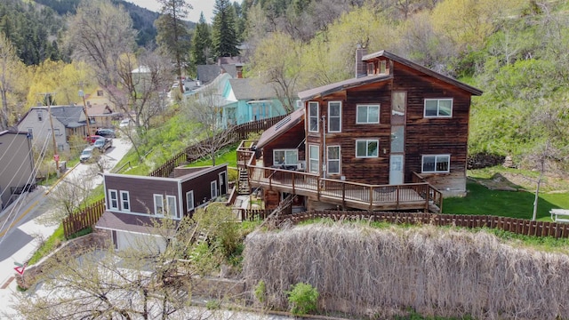 10 Centennial Ave, Deadwood, SD 57732 - rear view of house with a wooden deck and a wooded view