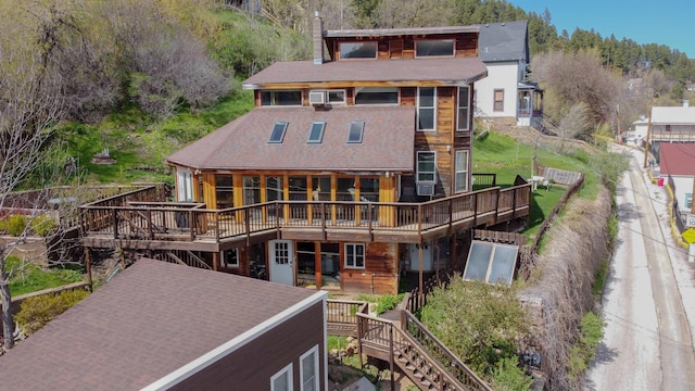 10 Centennial Ave, Deadwood, SD 57732 - back of property with a deck and a chimney