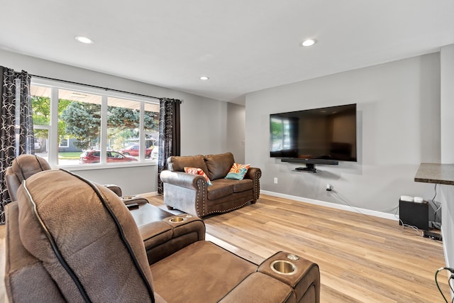 living room featuring recessed lighting, wood finished floors, and baseboards