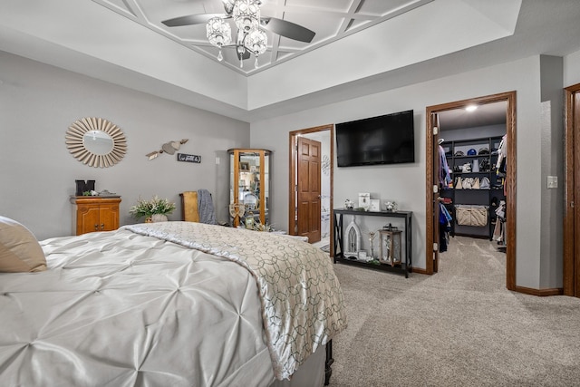 4127 Quiment Ct, Rapid City, SD 57702 - bedroom with light carpet, a walk in closet, baseboards, a closet, and a ceiling fan