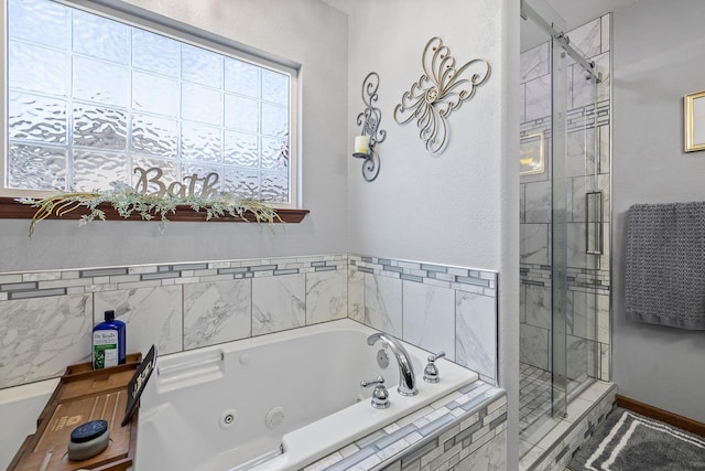 4127 Quiment Ct, Rapid City, SD 57702 - bathroom with a shower stall and a tub with jets