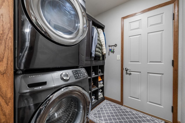 4127 Quiment Ct, Rapid City, SD 57702 - washroom with stacked washer / drying machine and baseboards