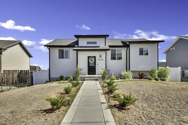 1234 Juneau Dr, Box Elder, SD 57719 - view of front of house with fence and roof with shingles