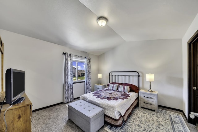 1234 Juneau Dr, Box Elder, SD 57719 - bedroom featuring vaulted ceiling, baseboards, and light colored carpet
