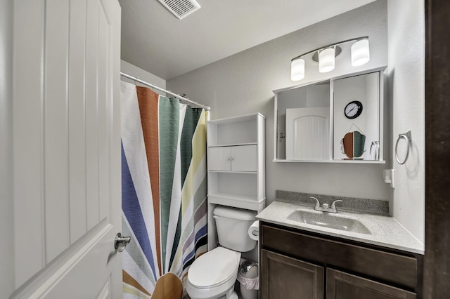 1234 Juneau Dr, Box Elder, SD 57719 - bathroom with toilet, vanity, and a shower with curtain