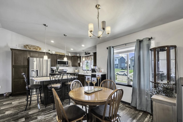 1234 Juneau Dr, Box Elder, SD 57719 - dining area featuring dark wood finished floors, a chandelier, vaulted ceiling, recessed lighting, and baseboards