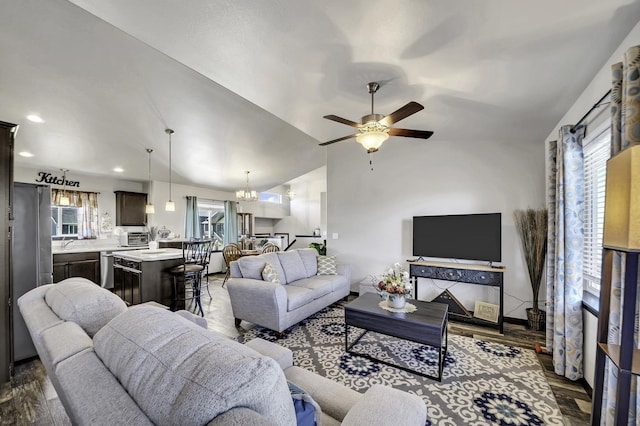 1234 Juneau Dr, Box Elder, SD 57719 - living room with ceiling fan, a chandelier, vaulted ceiling, and dark wood-style floors
