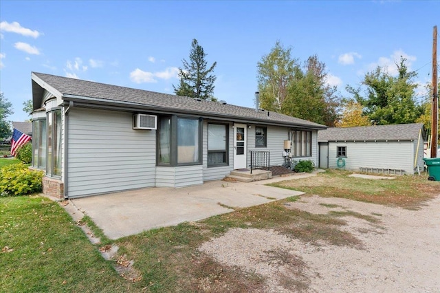 1542 Davenport St, Sturgis, SD 57785 - view of front of home with a patio area and a wall unit AC
