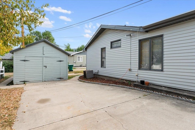 1542 Davenport St, Sturgis, SD 57785 - rear view of house featuring a patio area, central AC unit, and an outbuilding