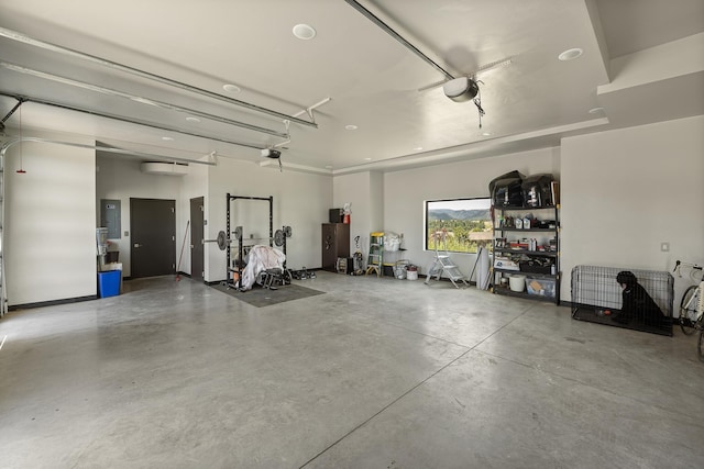 garage featuring a garage door opener and electric panel