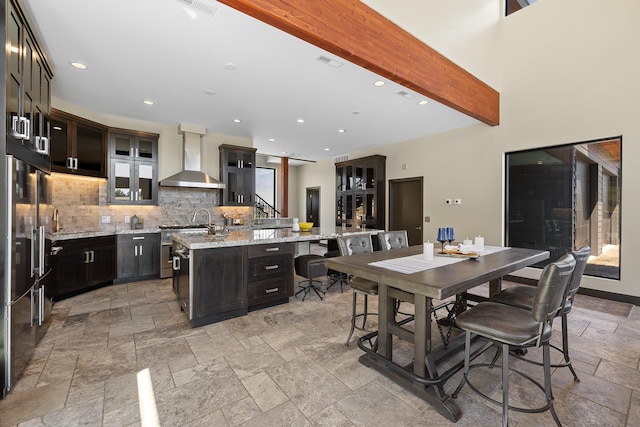 dining space with stone tile flooring and recessed lighting