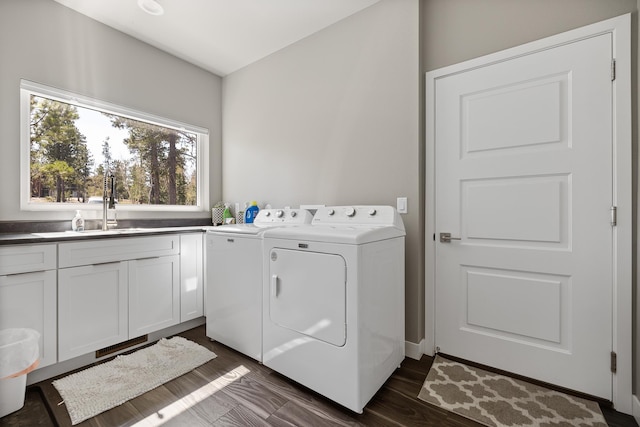 21271 Ridgewood Trl, Lead, SD 57754 - laundry area with washing machine and dryer, cabinet space, and dark wood-style flooring