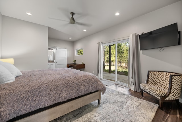 21271 Ridgewood Trl, Lead, SD 57754 - bedroom featuring access to outside, wood finished floors, recessed lighting, a barn door, and a ceiling fan