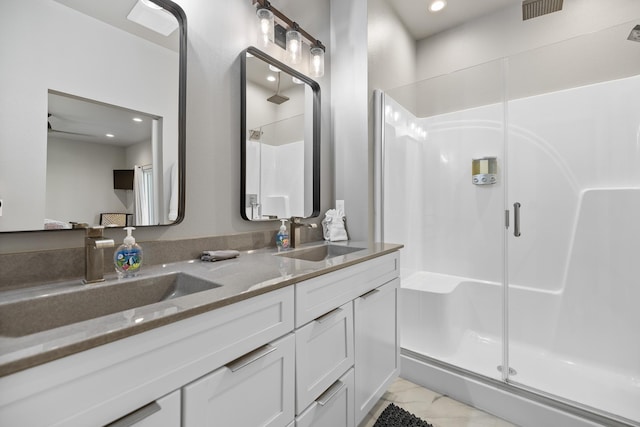 21271 Ridgewood Trl, Lead, SD 57754 - bathroom featuring a stall shower, double vanity, and recessed lighting