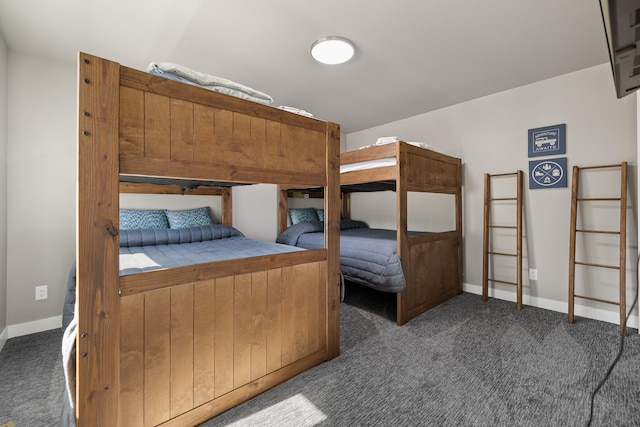 21271 Ridgewood Trl, Lead, SD 57754 - bedroom featuring dark carpet and baseboards