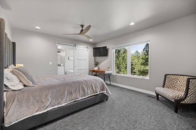 21271 Ridgewood Trl, Lead, SD 57754 - bedroom with a barn door, carpet, recessed lighting, baseboards, and ceiling fan