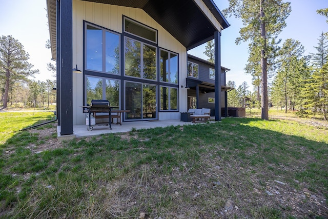 21271 Ridgewood Trl, Lead, SD 57754 - back of property featuring a yard, a patio, and central air condition unit