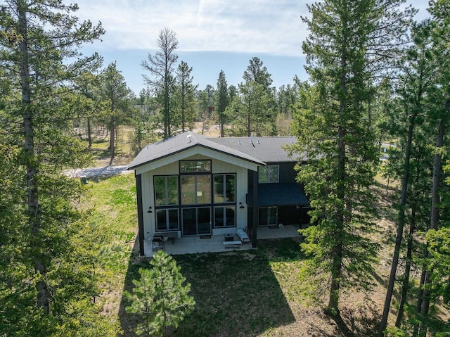 21271 Ridgewood Trl, Lead, SD 57754 - back of house with a patio and roof with shingles