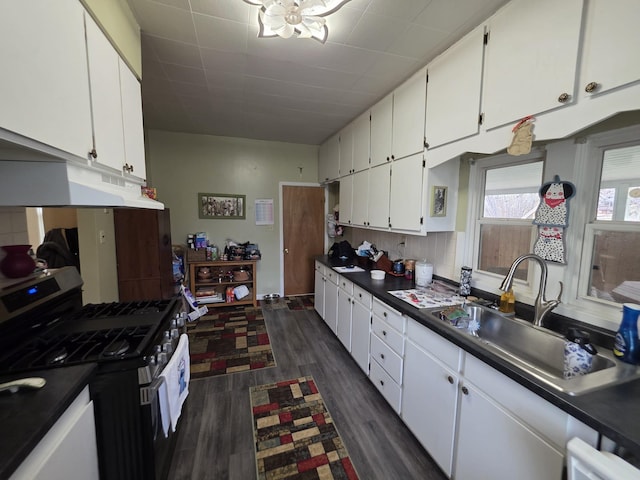 142 W Summit St, Lead, SD 57754 - kitchen with stainless steel range with gas stovetop, a sink, white cabinets, and dark countertops