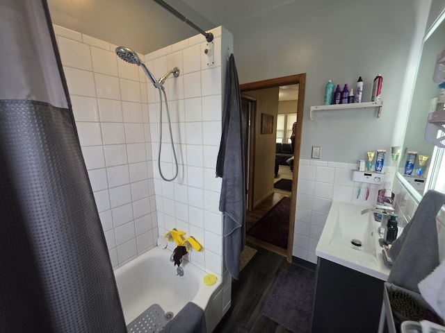 142 W Summit St, Lead, SD 57754 - full bathroom with shower / bath combo, tile walls, a wainscoted wall, wood finished floors, and vanity