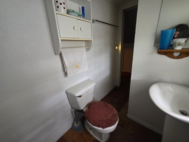 142 W Summit St, Lead, SD 57754 - bathroom with baseboards, toilet, and a sink