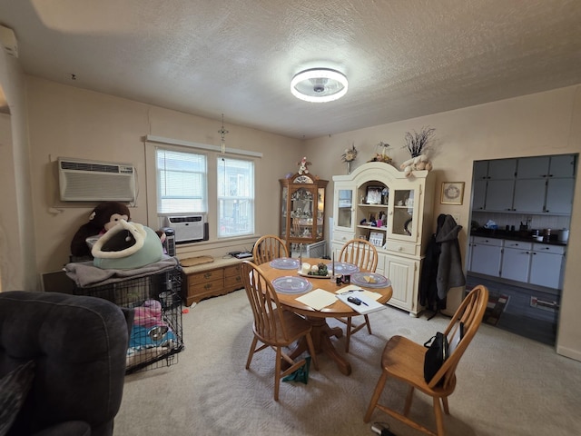 142 W Summit St, Lead, SD 57754 - dining area featuring light colored carpet, a textured ceiling, a wall unit AC, and cooling unit