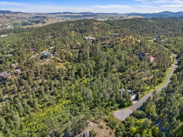 326 Nob Hill Rd, Spearfish, SD 57783 - aerial view of property's location with a heavily wooded area, property parcel outlined, and a mountain backdrop