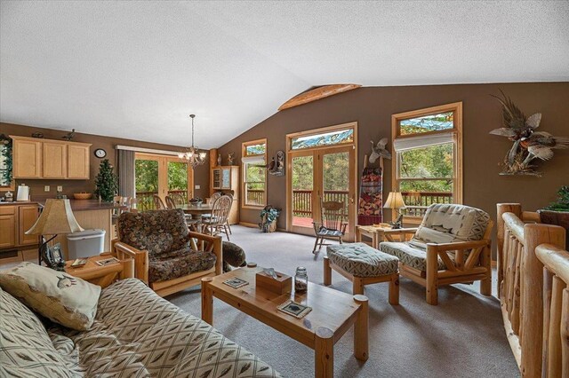 326 Nob Hill Rd, Spearfish, SD 57783 - living area with carpet floors, a chandelier, vaulted ceiling, and a textured ceiling
