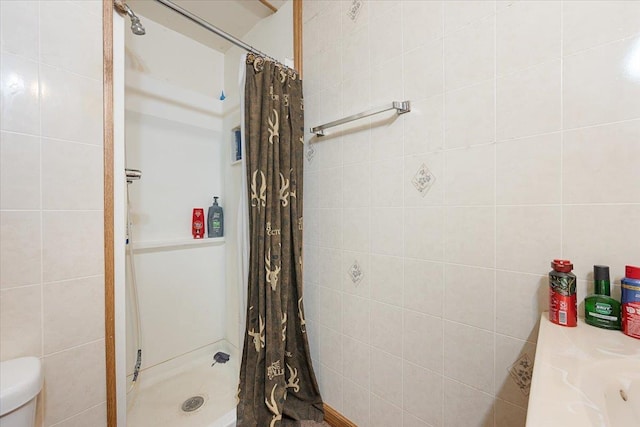 24 Mckinley St, Deadwood, SD 57732 - full bathroom featuring a stall shower, tile walls, and toilet