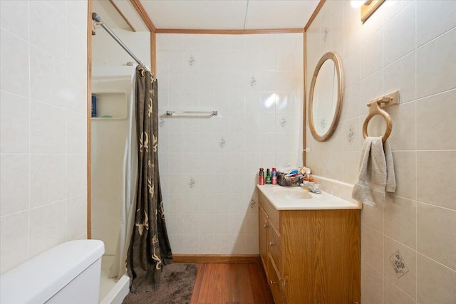 24 Mckinley St, Deadwood, SD 57732 - bathroom featuring tile walls, a shower with curtain, vanity, toilet, and wood finished floors