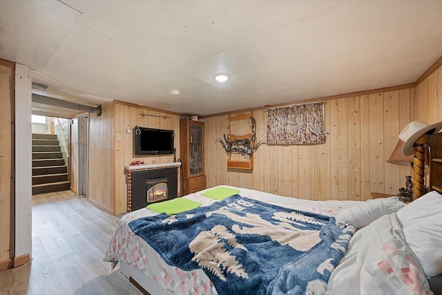 24 Mckinley St, Deadwood, SD 57732 - bedroom featuring wood walls and light wood-style flooring
