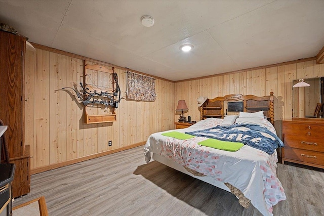 24 Mckinley St, Deadwood, SD 57732 - bedroom featuring wood finished floors, wood walls, and baseboards