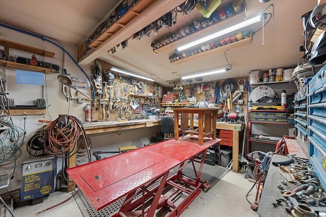24 Mckinley St, Deadwood, SD 57732 - miscellaneous room with a workshop area and concrete flooring