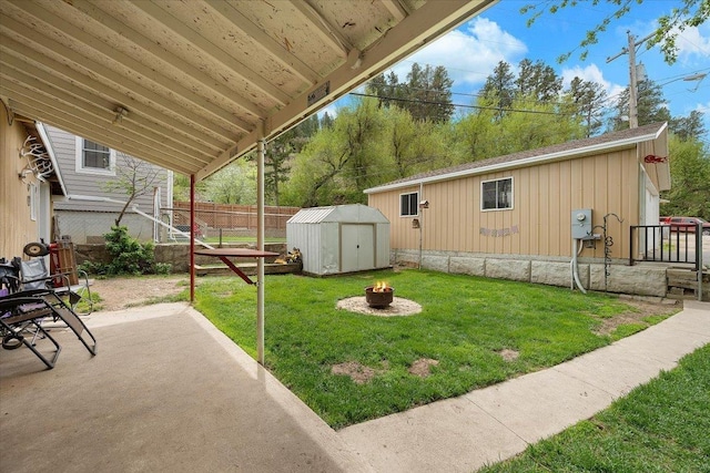 24 Mckinley St, Deadwood, SD 57732 - view of yard featuring a fire pit, a patio, an outbuilding, and a shed