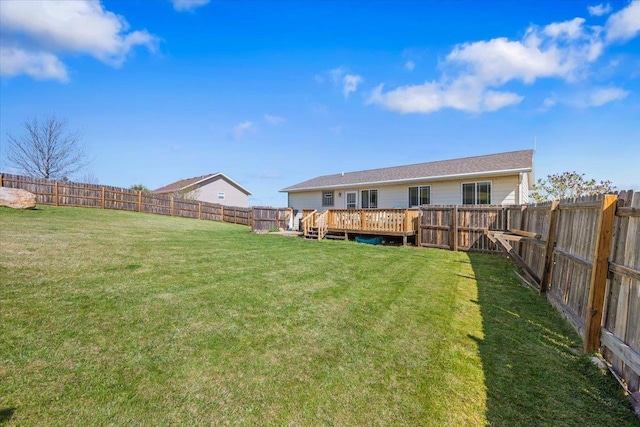 view of yard featuring a wooden deck
