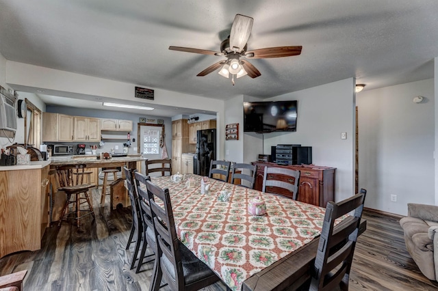 12944 Larene Dr, Black Hawk, SD 57718 - dining area featuring dark wood-type flooring, ceiling fan, and baseboards