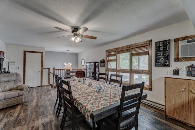 12944 Larene Dr, Black Hawk, SD 57718 - dining room with ceiling fan, dark wood-style flooring, a textured ceiling, a chandelier, and baseboard heating
