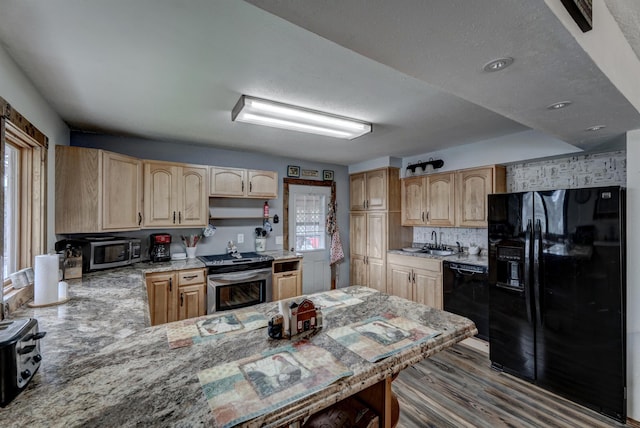 12944 Larene Dr, Black Hawk, SD 57718 - kitchen featuring black appliances, light brown cabinetry, a sink, a peninsula, and wood finished floors