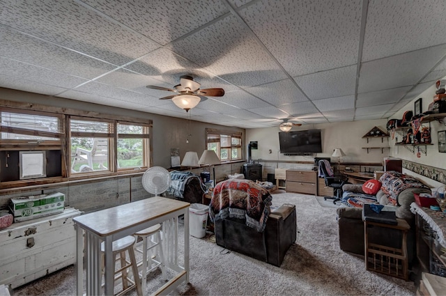 12944 Larene Dr, Black Hawk, SD 57718 - carpeted living room featuring a ceiling fan and a paneled ceiling