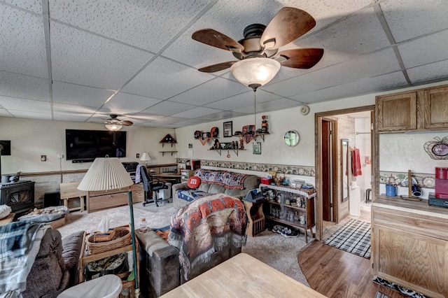 12944 Larene Dr, Black Hawk, SD 57718 - living room with ceiling fan, a drop ceiling, and a wood stove