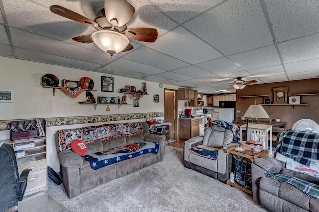 12944 Larene Dr, Black Hawk, SD 57718 - living area featuring a ceiling fan, a paneled ceiling, and light carpet