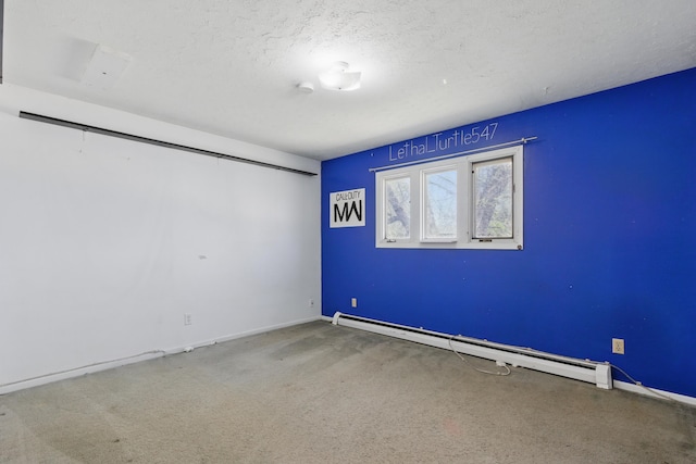 5753 Pluto St, Rapid City, SD 57703 - carpeted empty room featuring a baseboard heating unit, a textured ceiling, and baseboards
