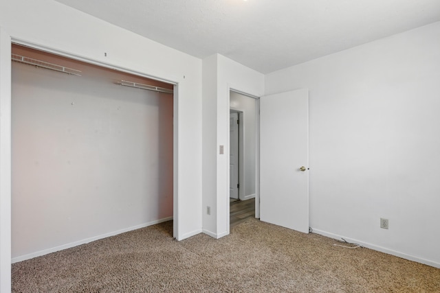 5753 Pluto St, Rapid City, SD 57703 - unfurnished bedroom featuring carpet, a closet, and baseboards