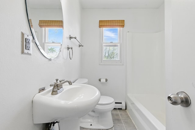 5753 Pluto St, Rapid City, SD 57703 - full bathroom with a baseboard heating unit, tile patterned floors, plenty of natural light, and toilet