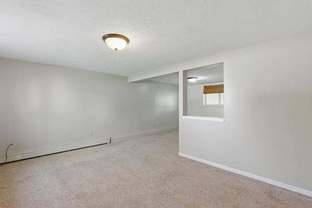5753 Pluto St, Rapid City, SD 57703 - basement featuring carpet floors, baseboards, and a baseboard radiator